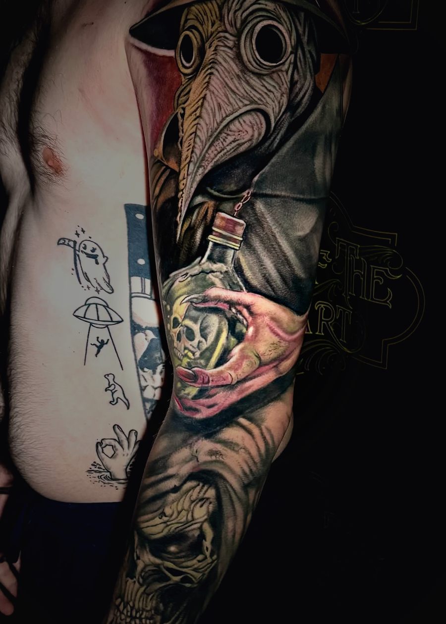 Color plague doctor full sleeve with skulls below the elbow.